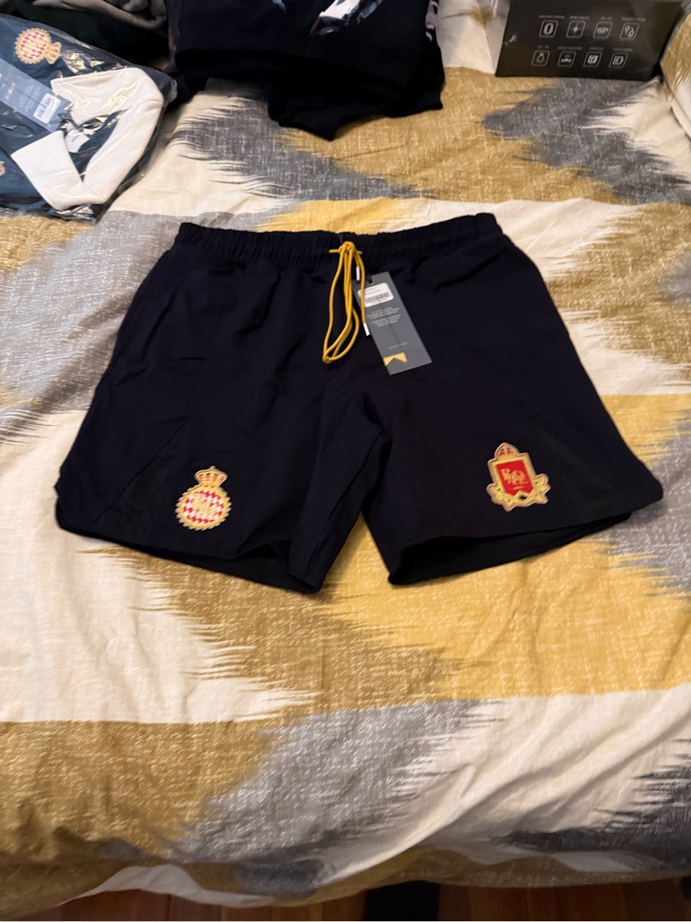 Rhude Black Athletic Shorts with Gold Drawcord and Red Crest